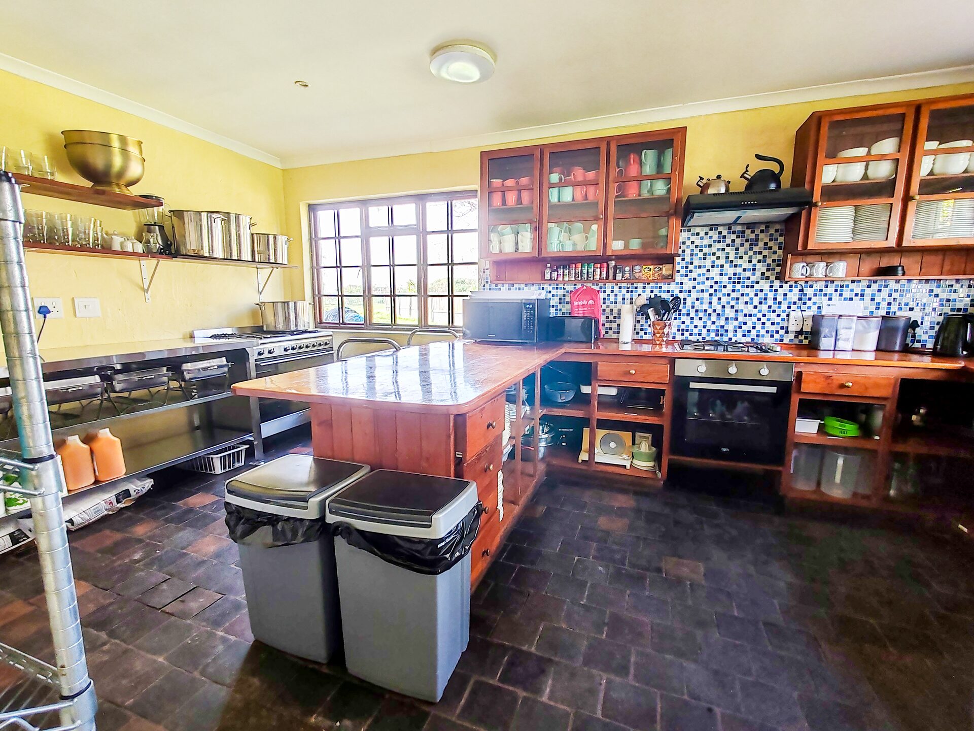 Kitchen area with worktops and windows